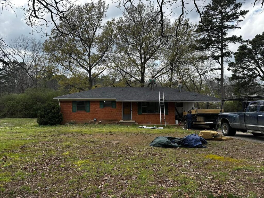 Residential roof replacement project on brick home by J Cole Roofing & Construction in Central Arkansas