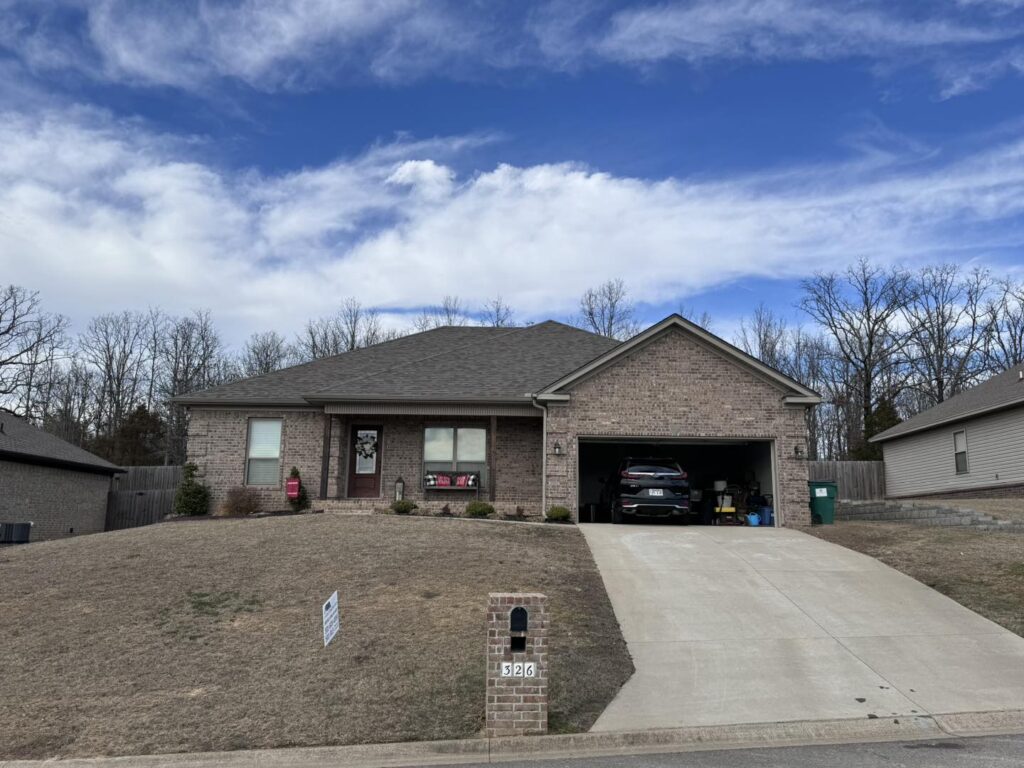 Residential roof replacement on brick home by J Cole Roofing & Construction in Austin AR