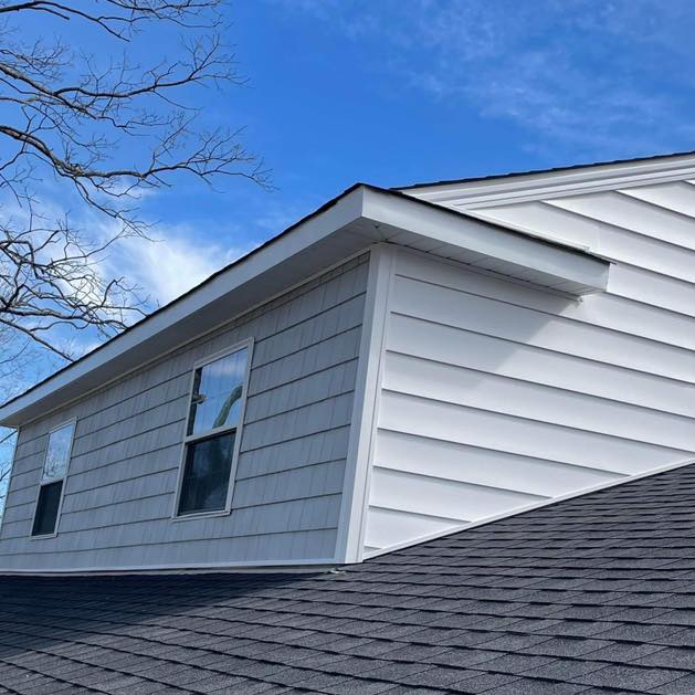 Vinyl siding and roofing installation detail by J Cole Roofing & Construction in Austin AR