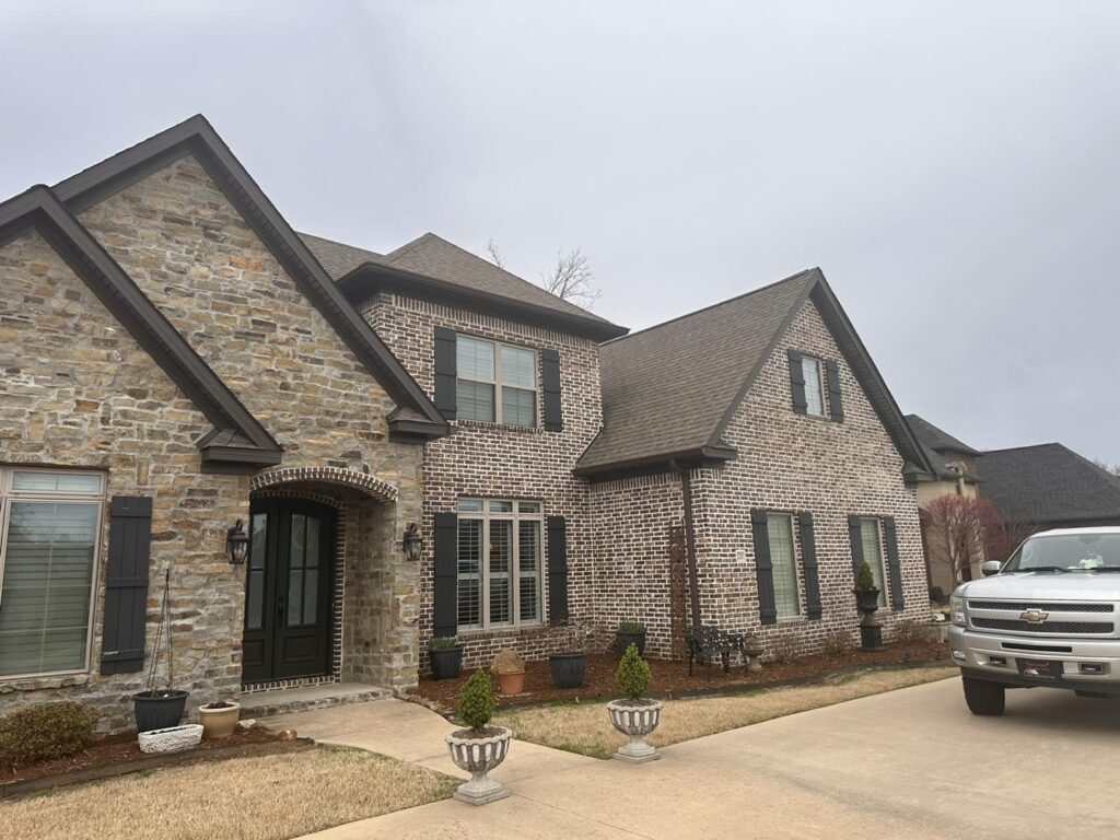 Residential roof replacement on brick home by J Cole Roofing & Construction in Austin AR