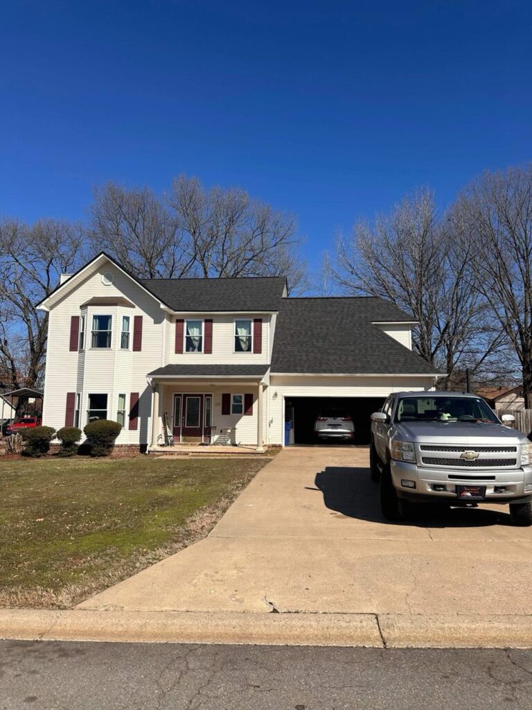 Residential roof replacement project on two story home by J Cole Roofing & Construction in Austin AR