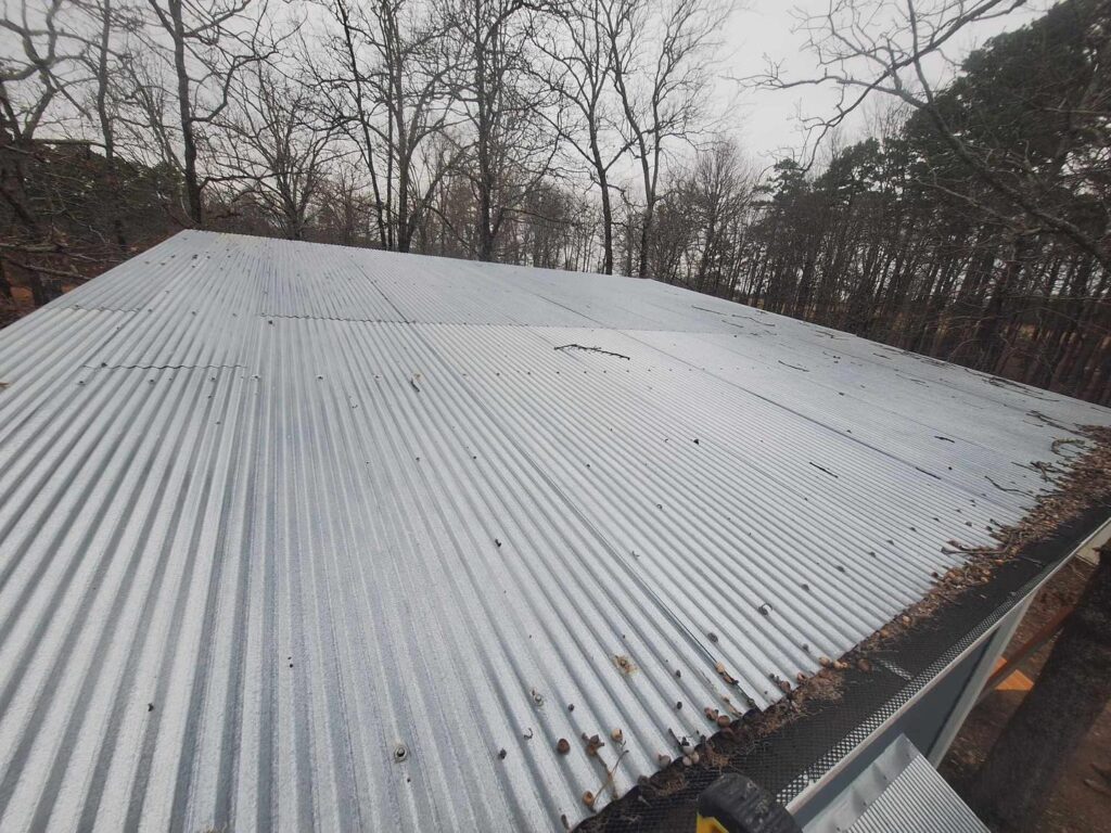Corrugated metal roof installation on residential home by J Cole Roofing & Construction in Austin AR